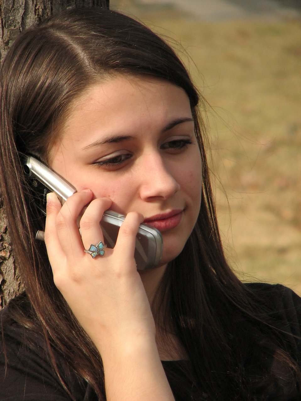 Teenage girl talking on a cell phone : Free Stock Photo