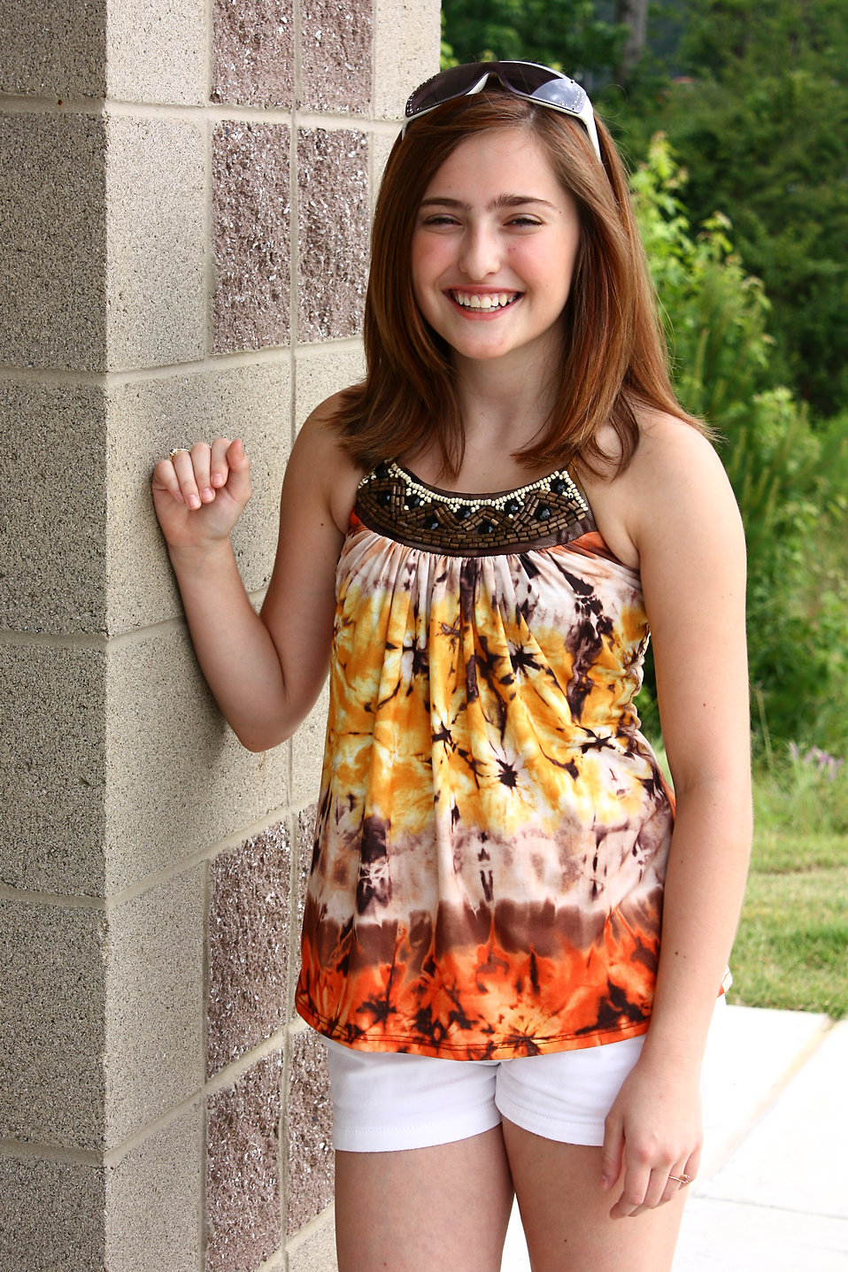 A cute young girl posing outdoors : Free Stock Photo