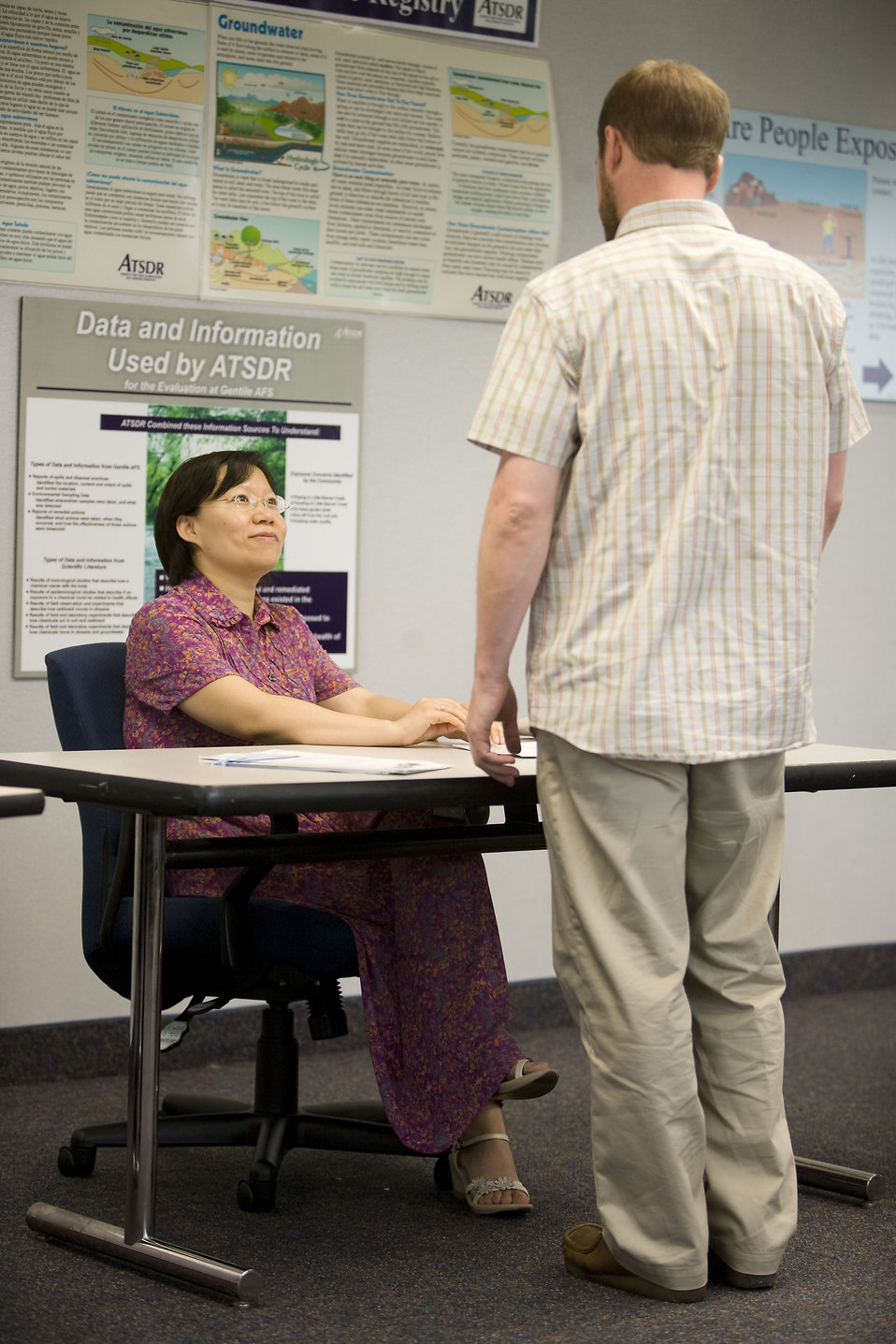 Men and women at a town hall meeting : Free Stock Photo