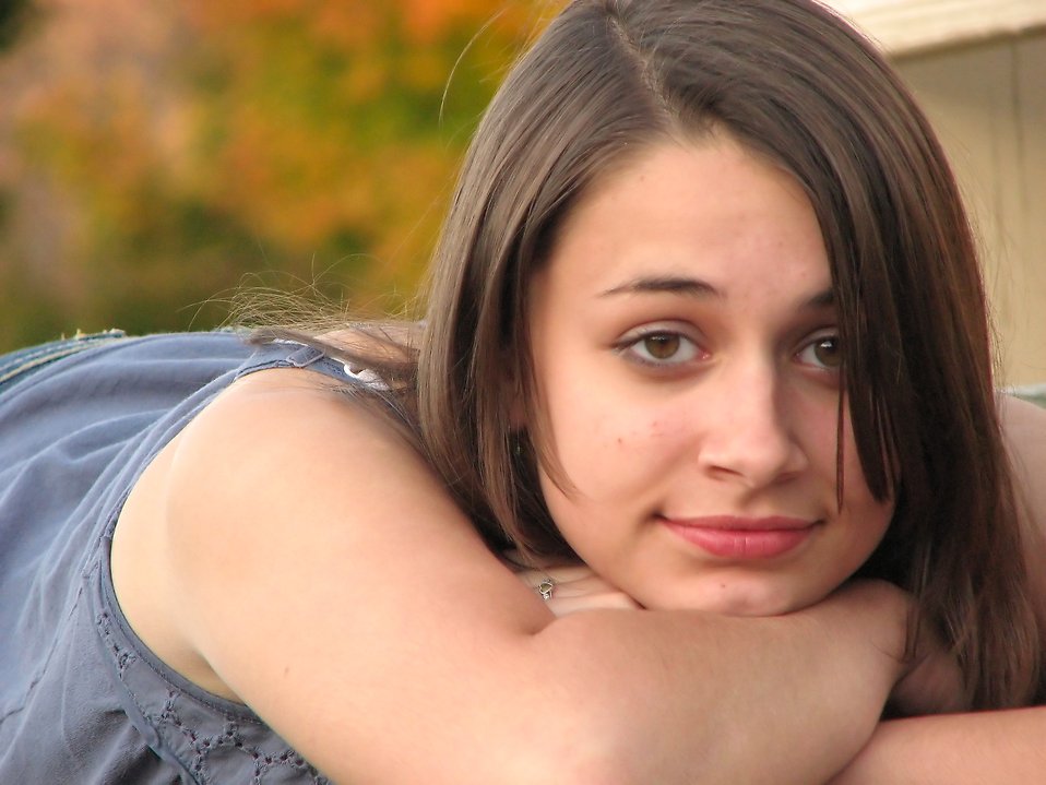 Close-up portrait of a beautiful teen girl outdoors : Free Stock Photo