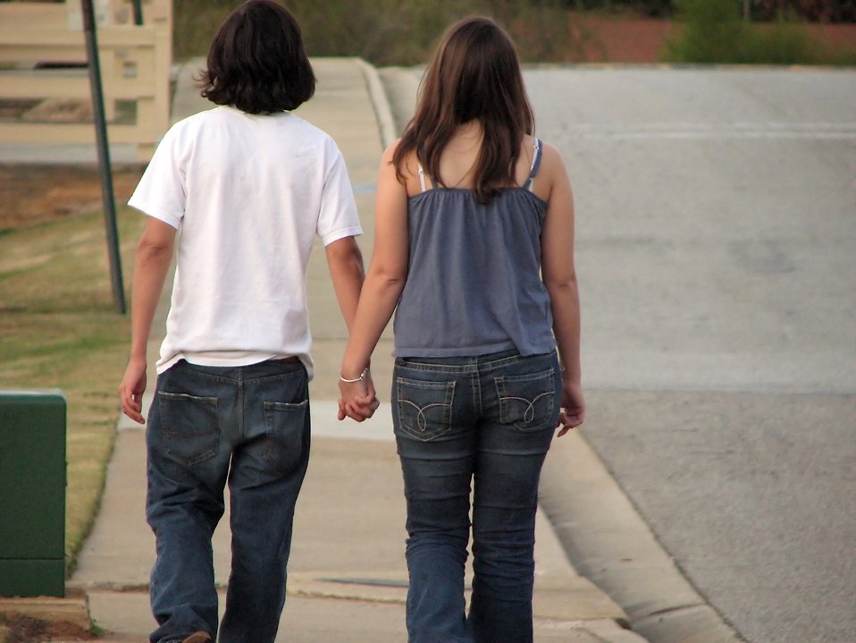 girl and boy holding hands