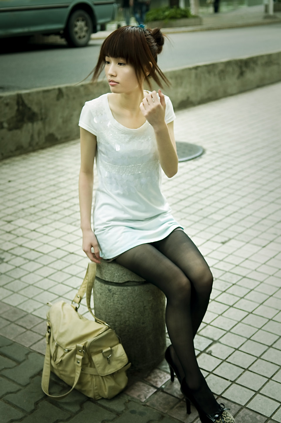 A beautiful Chinese girl posing outdoors : Free Stock Photo