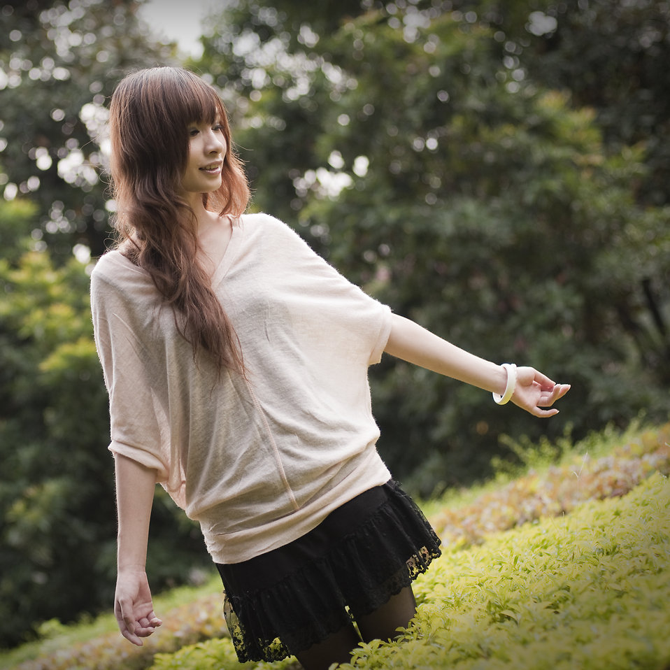 A beautiful Chinese girl posing outdoors : Free Stock Photo