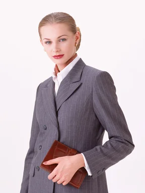 Free Stock Photo: A beautiful blonde businesswoman holding a planner isolated on a white background