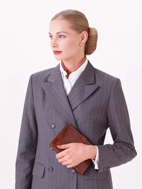 Free Stock Photo: A beautiful business woman holding a planner isolated on a white background