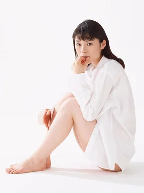 Free Stock Photo: A beautiful woman sitting down isolated on a white background
