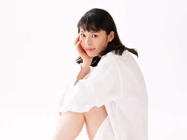 Free Stock Photo: A beautiful woman sitting down isolated on a white background