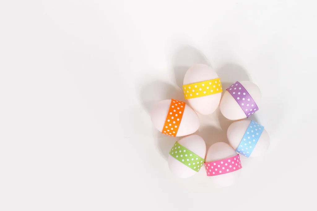 Six Easter eggs with ribbons isolated on a white background : Free Stock Photo