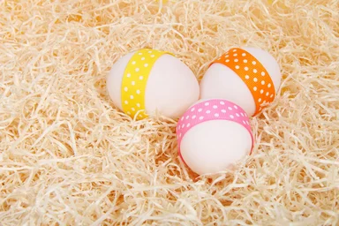 Free Stock Photo: Easter eggs with ribbons on straw