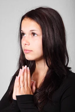 Free Stock Photo: A beautiful young woman praying