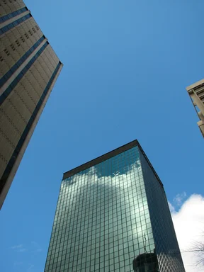 Free Stock Photo: Tall office buildings with a blue sky background
