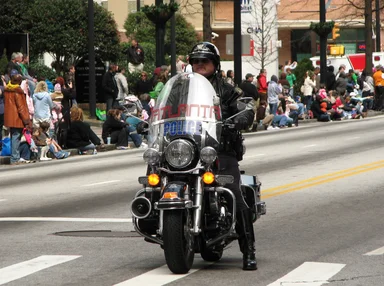 Free Stock Photo: A police officer on a motorycle in the 2010 Saint Patricks Day Parade in Atlanta, Georgia