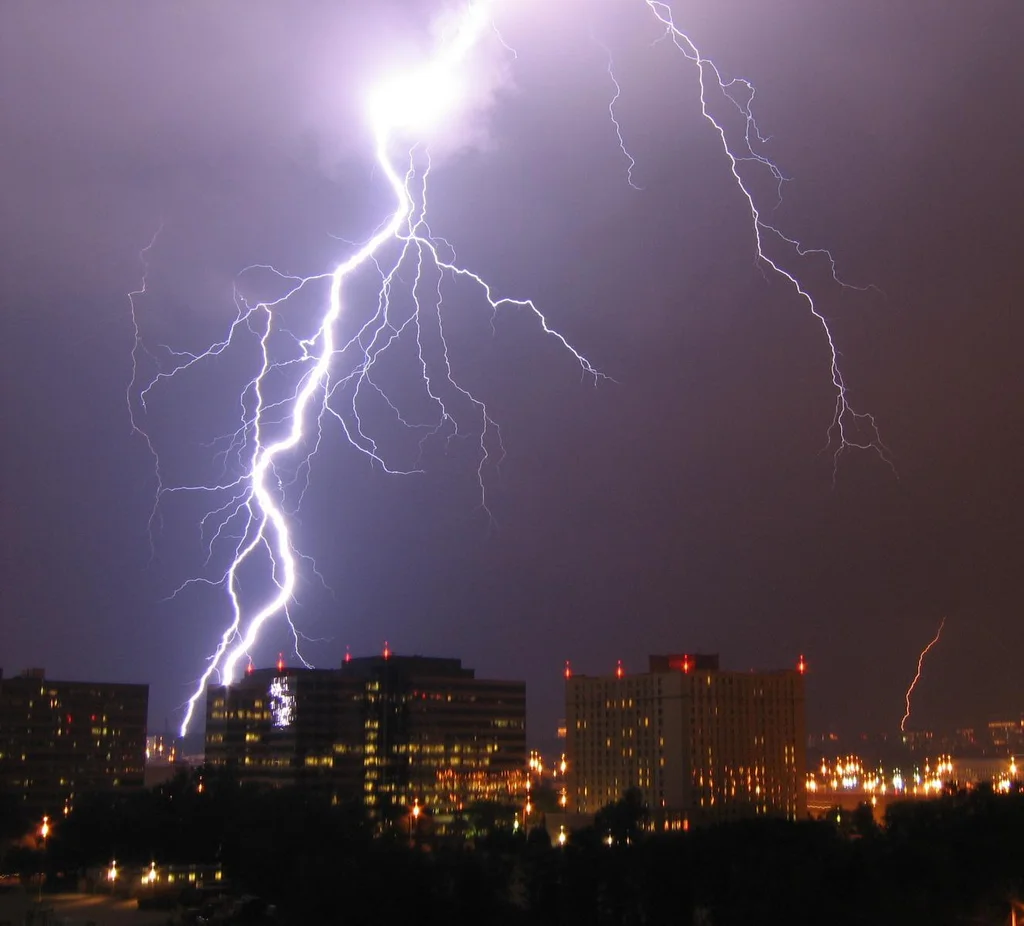 Lightning striking over a city : Free Stock Photo