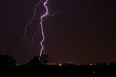 Free Stock Photo: Lightning striking over a city at night