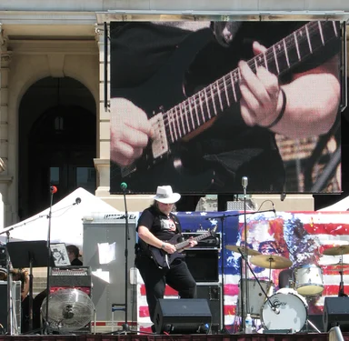 Free Stock Photo: A man playing a guitar at the 2010 Atlanta tax day tea party in Atlanta, Georgia
