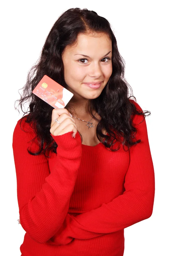 A beautiful woman holding a credit card : Free Stock Photo