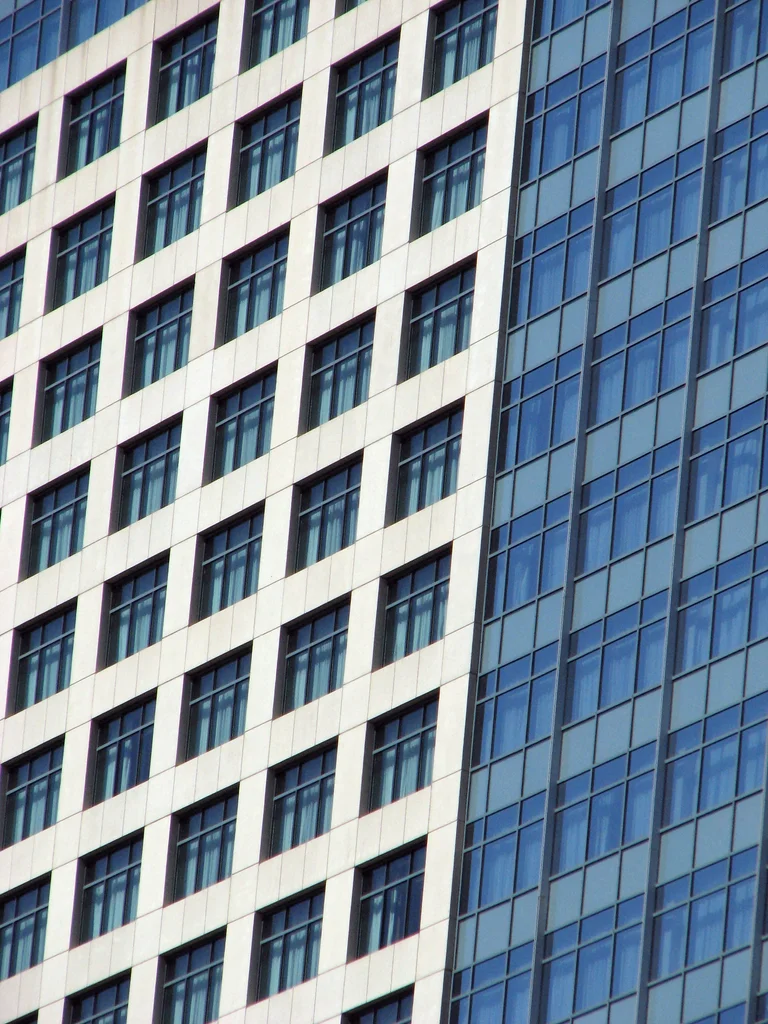 Close up side of a modern glass building : Free Stock Photo