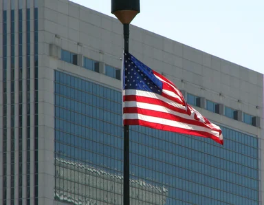 Free Stock Photo: US flag in front of a modern glass building