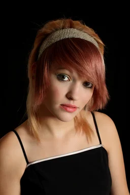Free Stock Photo: A beautiful young woman posing with a black background
