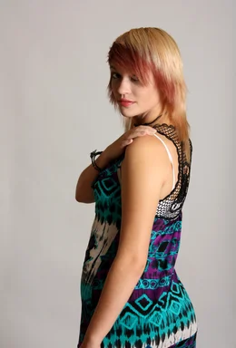 Free Stock Photo: A beautiful young woman posing before a grey background