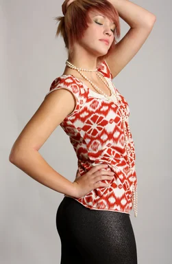 Free Stock Photo: A beautiful young woman wearing pearls posing on a gray background
