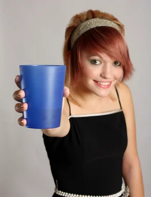 Free Stock Photo: A beautiful girl offering a plastic cup drink
