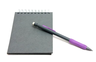 Free Stock Photo: A pad of paper and a pencil isolated on a white background