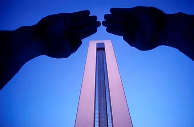 Free Stock Photo: Hands touching above a skyscraper