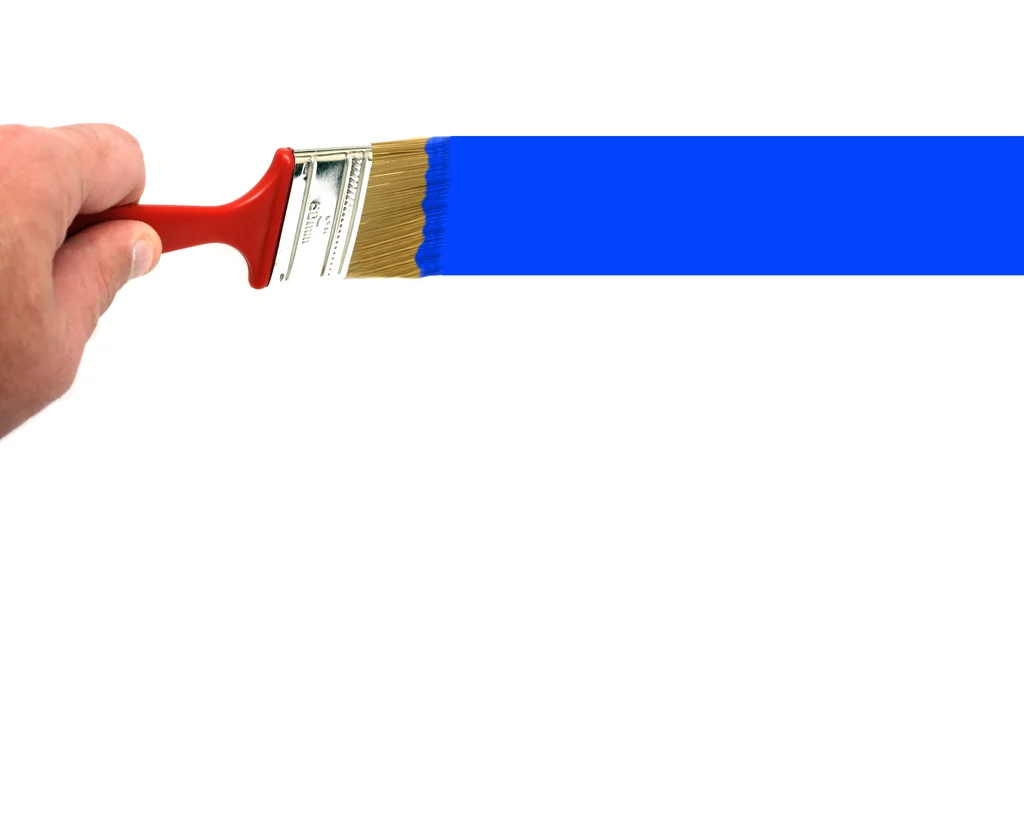 A hand painting a blue line with a paint brush : Free Stock Photo