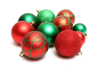 Free Stock Photo: Red and green Christmas ornaments isolated on a white background