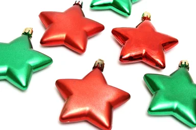 Free Stock Photo: Red and green star shaped Christmas ornaments isolated on a white background