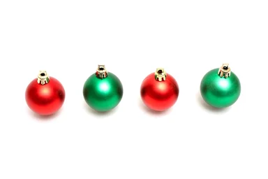 Free Stock Photo: Red and green Christmas ornaments isolated on a white background