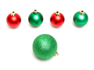 Free Stock Photo: Red and green Christmas ornaments isolated on a white background