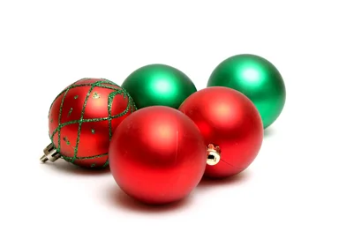 Free Stock Photo: Red and green Christmas ornaments isolated on a white background