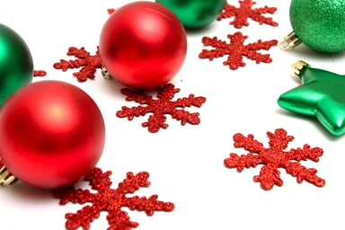 Free Stock Photo: Red and green Christmas ornaments isolated on a white background