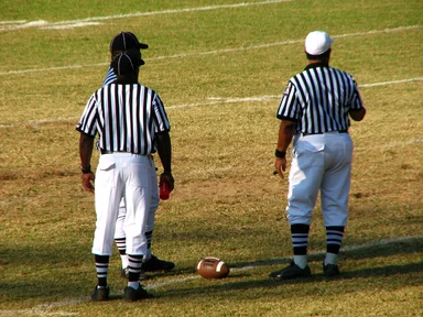 Free Stock Photo: Football referees standing on a field