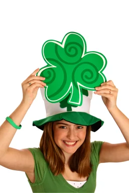 Free Stock Photo: A cute young girl dressed up for Saint Patrick's Day holding a large clover