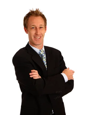 Free Stock Photo: A young businessman with crossed arms isolated on a white background
