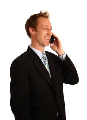 Free Stock Photo: A young businessman talking on a cell phone