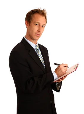 Free Stock Photo: A young businessman holding a clipboard and pen