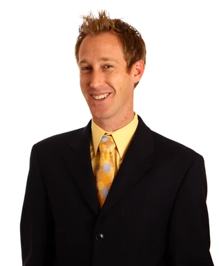 Free Stock Photo: A young businessman in a suit and tie isolated on a white background