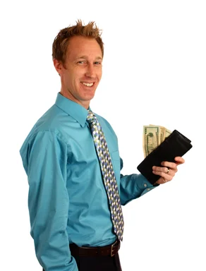 Free Stock Photo: A young businessman holding a wallet with money