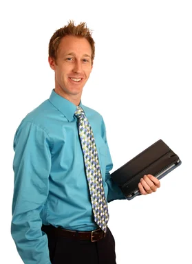 Free Stock Photo: A young businessman holding a binder