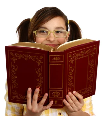 Free Stock Photo: A smart girl with glasses reading a book