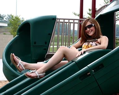 Free Stock Photo: A beautiful young girl playing on a playground