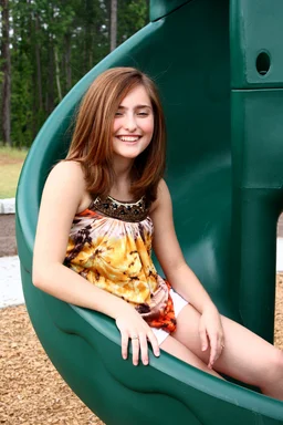 Free Stock Photo: A beautiful young girl playing on a playground