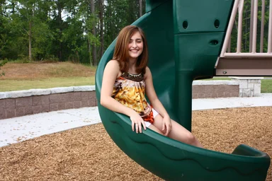 Free Stock Photo: A beautiful young girl playing on a playground