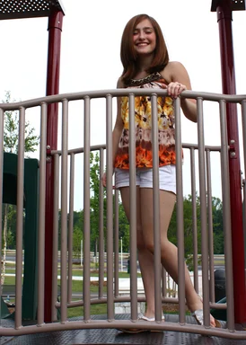 Free Stock Photo: A beautiful young girl playing on a playground
