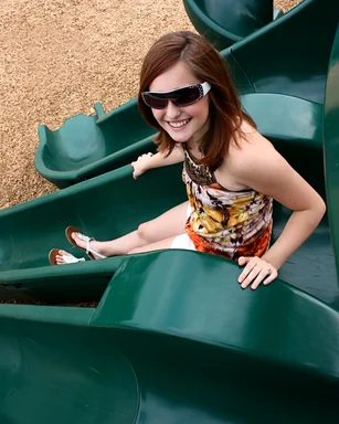 Free Stock Photo: A beautiful young girl playing on a playground