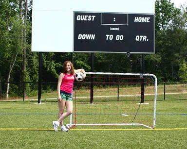 Free Stock Photo: A cute young girl posing with a soccer ball